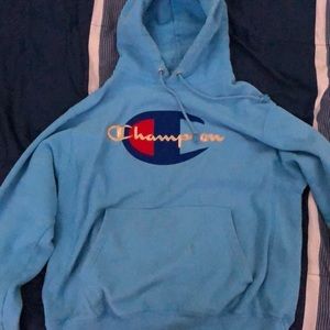 Light blue champion hoodie with gold lettering